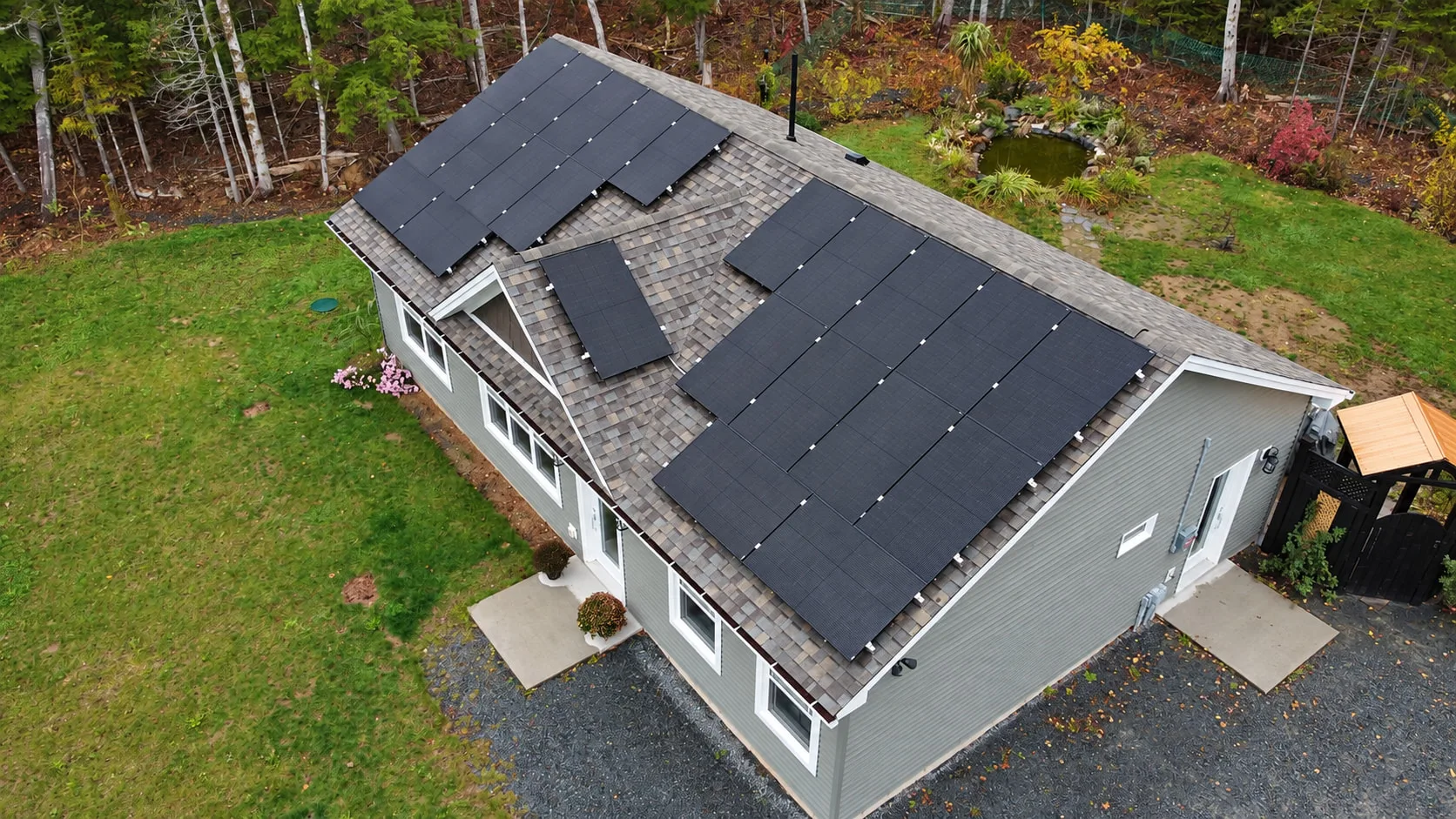 Finished JC Power solar installation on a grey house